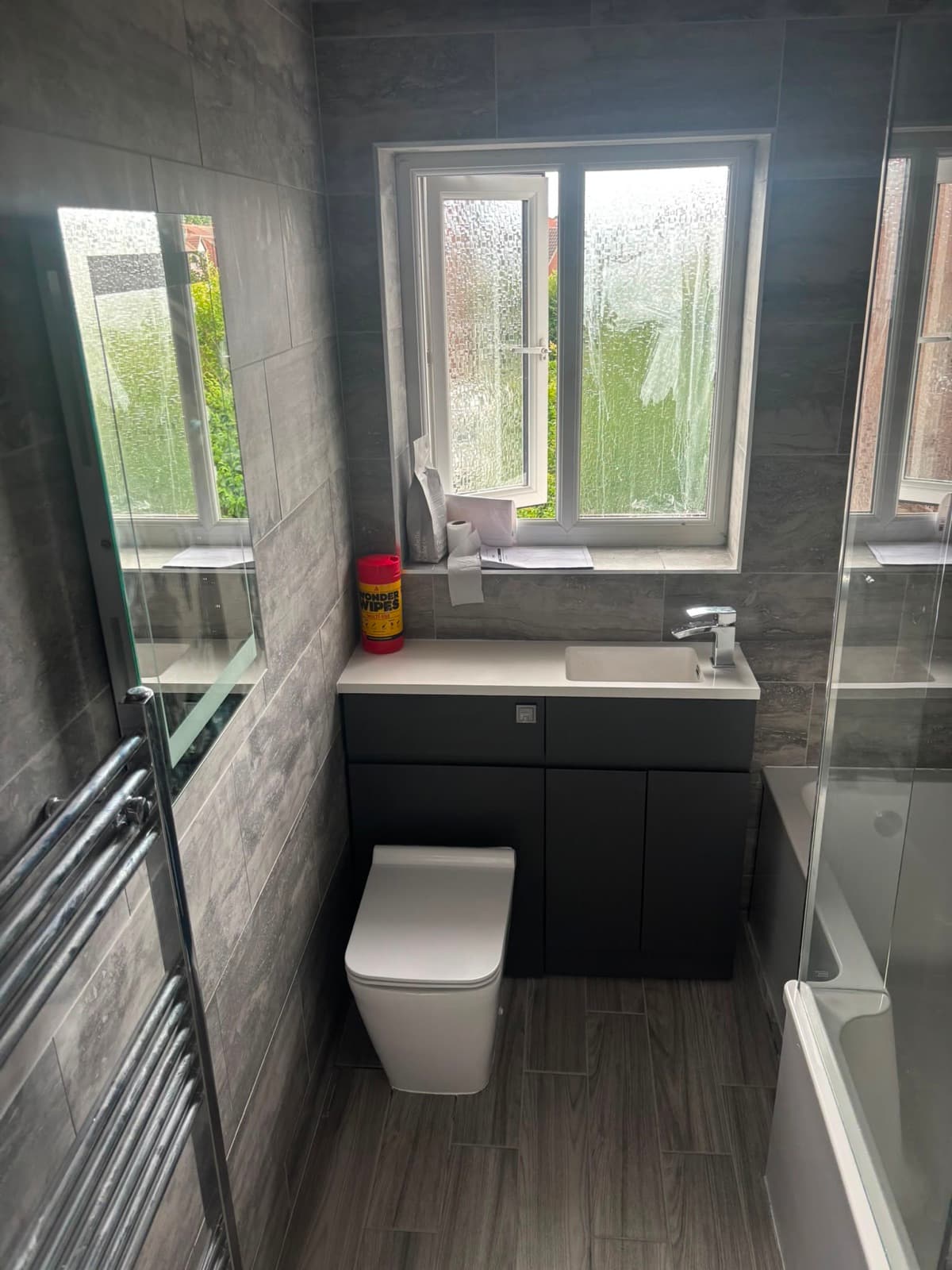 Bathroom with a window and fitted WC